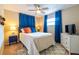 Bedroom with neutral tones, plush rug, and a ceiling fan, offering a comfortable retreat at 4963 Hoperita St, Orlando, FL 32812