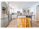 Open kitchen with granite countertops, stainless steel appliances, a breakfast bar and an eat-in dining area at 4963 Hoperita St, Orlando, FL 32812