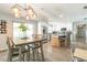 Open kitchen featuring stainless steel appliances, granite countertops, and a view to the dining and living areas at 4963 Hoperita St, Orlando, FL 32812