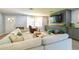 Comfortable living room with a stylish sectional, built-in shelving, and a bright, airy ambiance at 4963 Hoperita St, Orlando, FL 32812