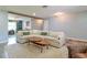 Bright and spacious living area with a large sectional sofa, cozy rug, and modern decor at 4963 Hoperita St, Orlando, FL 32812