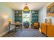 Chic home office featuring stylish decor, a modern desk, and ample shelving for organization at 4963 Hoperita St, Orlando, FL 32812