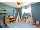 Spacious playroom filled with toys and natural light; perfect for activities at 4963 Hoperita St, Orlando, FL 32812