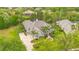 Spacious home features lush landscaping, a private driveway, and seamlessly connected outdoor living spaces at 5241 Vista Club Run, Sanford, FL 32771