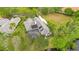 Elegant home with a screened-in pool, lush landscaping, and solar panels at 5241 Vista Club Run, Sanford, FL 32771