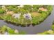 Stunning aerial view of a waterfront home with mature trees and a private pool at 5241 Vista Club Run, Sanford, FL 32771
