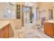 Bathroom featuring soaking tub with decorative columns and chandelier at 5241 Vista Club Run, Sanford, FL 32771