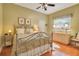Comfortable bedroom featuring a ceiling fan, plush bedding, and window at 5241 Vista Club Run, Sanford, FL 32771