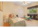 Bedroom with hardwood floors, ceiling fan, a window and double closet doors at 5241 Vista Club Run, Sanford, FL 32771