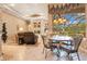 Bright breakfast area with fireplace and large window overlooking the pool at 5241 Vista Club Run, Sanford, FL 32771