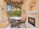 Charming breakfast nook with fireplace and serene view of the backyard pool at 5241 Vista Club Run, Sanford, FL 32771