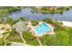 Aerial shot of community pool, jacuzzi, clubhouse, and lakeside beach at 5241 Vista Club Run, Sanford, FL 32771