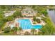 Beautiful community pool with lap lanes, sun loungers, and well-maintained landscaping at 5241 Vista Club Run, Sanford, FL 32771