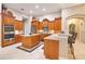 Beautiful kitchen boasts stainless appliances, custom cabinets, and center island at 5241 Vista Club Run, Sanford, FL 32771