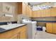 Bright laundry room with washer, dryer, utility sink, and ample storage at 5241 Vista Club Run, Sanford, FL 32771