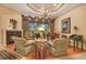 Inviting living room showcases grand piano, fireplace, and outdoor view at 5241 Vista Club Run, Sanford, FL 32771