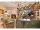 Comfortable living room with fireplace, piano, and access to outdoor space at 5241 Vista Club Run, Sanford, FL 32771