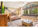 Spacious bedroom with large windows, ceiling fan, and sitting area at 5241 Vista Club Run, Sanford, FL 32771