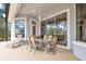 Covered patio with ceiling fan and dining table and chairs at 5241 Vista Club Run, Sanford, FL 32771