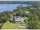 An aerial view of a beautiful home nestled amongst the trees with lake views at 5351 Carson St, St Cloud, FL 34771