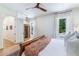 Bright bedroom with wood-look ceiling fan, hardwood floors, and a sauna for ultimate relaxation at 5351 Carson St, St Cloud, FL 34771