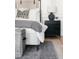 Cozy bedroom showing a stylish nightstand, decorative lamps, and patterned rug at 5351 Carson St, St Cloud, FL 34771
