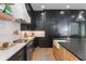 Bright kitchen featuring custom cabinetry, a farmhouse sink, and stainless steel appliances at 5351 Carson St, St Cloud, FL 34771