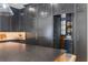 Modern kitchen features black cabinetry, large island with seating, and stainless steel appliances at 5351 Carson St, St Cloud, FL 34771
