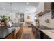 Gourmet kitchen with an oversized island, farmhouse sink, and high-end appliances, perfect for entertaining at 5351 Carson St, St Cloud, FL 34771