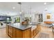 Gourmet kitchen featuring a large island with seating, open to the living area, offering seamless entertaining at 5351 Carson St, St Cloud, FL 34771