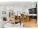 Spacious kitchen with a large center island, modern lighting, and hardwood floors throughout the area at 5351 Carson St, St Cloud, FL 34771