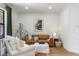 Comfortable living room showcasing a leather sofa, elegant decor, and lots of natural light at 5351 Carson St, St Cloud, FL 34771