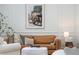 Stylish living room highlighting a leather sofa, decorative pillows, and ambient lighting at 5351 Carson St, St Cloud, FL 34771