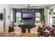 Bright and inviting living room featuring a custom media center, stylish furniture, and large windows at 5351 Carson St, St Cloud, FL 34771
