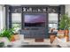Cozy living room featuring a built-in entertainment center and comfortable seating at 5351 Carson St, St Cloud, FL 34771
