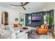 Comfortable living room showcasing a custom entertainment center and an abundance of natural light at 5351 Carson St, St Cloud, FL 34771