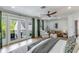 Tranquil main bedroom offering a private balcony, stylish furnishings, and serene decor at 5351 Carson St, St Cloud, FL 34771