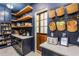 Walk-in pantry provides ample storage, a counter, and shelves for organizing kitchen necessities at 5351 Carson St, St Cloud, FL 34771