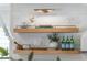 Kitchen shelving with books, glassware, and decorative elements providing an organized space at 5351 Carson St, St Cloud, FL 34771