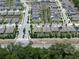A picturesque community with organized street layouts, green spaces, and uniform home designs stretches into the horizon at 5515 Palomino Pl, Apopka, FL 32712
