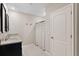Bathroom with granite vanity, patterned shower curtain, and tile floors at 5515 Palomino Pl, Apopka, FL 32712