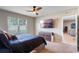 Cozy bedroom featuring a ceiling fan, large window, and access to the rest of the house at 5515 Palomino Pl, Apopka, FL 32712