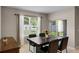 Contemporary dining area featuring a modern table set and sliding door access to the outdoors at 5515 Palomino Pl, Apopka, FL 32712