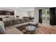 Comfortable living room with large windows and open access to the modern kitchen and dining area at 5515 Palomino Pl, Apopka, FL 32712