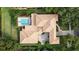 Aerial view of a home with tile roof and a spacious driveway and backyard at 6149 Blakeford Dr, Windermere, FL 34786