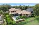 Aerial view of a luxurious home featuring a pool, screened-in porch, and lush landscaping at 6149 Blakeford Dr, Windermere, FL 34786