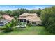 Lush backyard with a private pool, screened-in porch, tile roof and mature trees at 6149 Blakeford Dr, Windermere, FL 34786