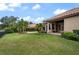 Expansive backyard showcasing a pool, spa, covered patio, and lush landscaping at 6149 Blakeford Dr, Windermere, FL 34786