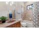 Well-lit bathroom featuring a tub, shower, decorative tile, and a plant at 6149 Blakeford Dr, Windermere, FL 34786