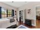 Bedroom featuring a window with natural lighting, a closet, and hardwood floors at 6149 Blakeford Dr, Windermere, FL 34786